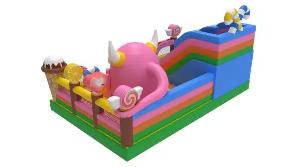 Plac Zabaw Słodki Potwór od Megaland - dmuchane, bajeczne królestwo pełne słodyczy z dużym, różowym potworem, zachęcające dzieci do zabawy wśród miękkich przeszkód i zjeżdżalni.